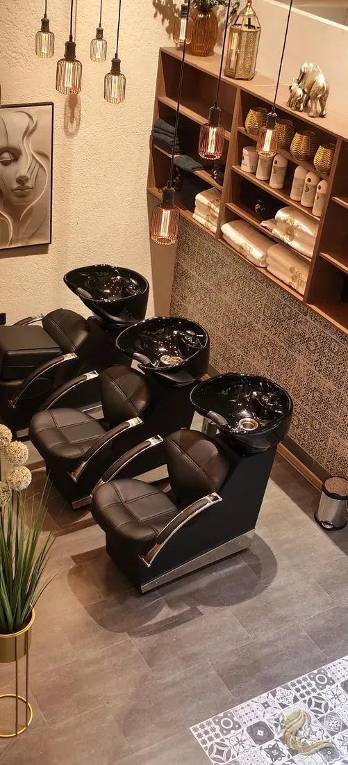 Hair wash stations with copper shelving